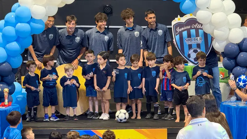 The youngest Juniors players with their coaches at the anniversary