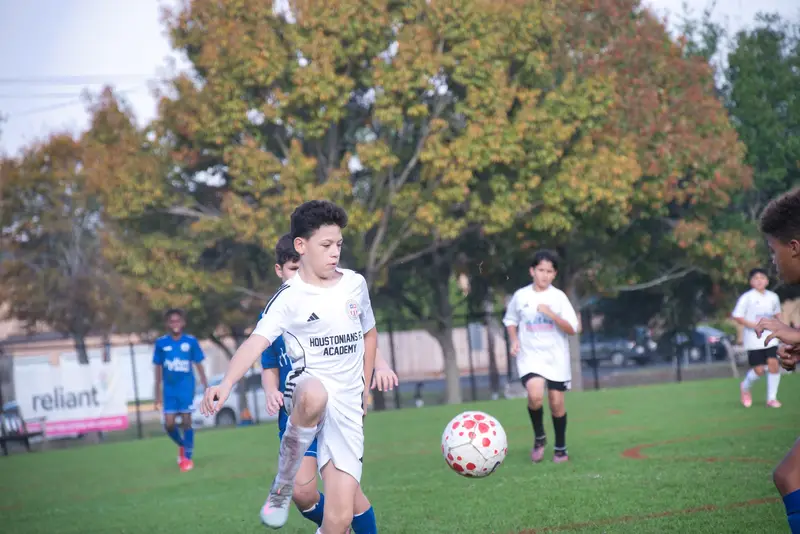 Player dribbling past a defender