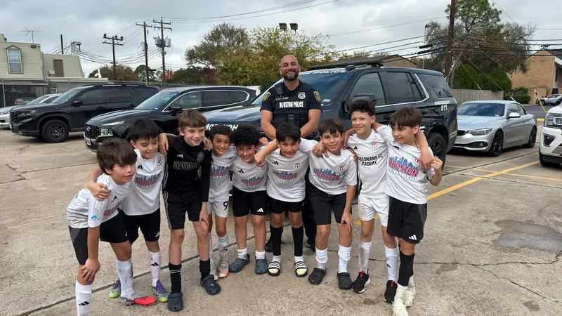 Team and coach together after a game